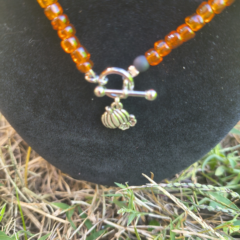 Orange Beaded Necklace with Silver Pumpkin Charm